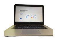 Front view showing the HP Chromebook powered on with 'Welcome to Chromebook' screen.