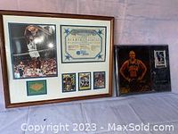 Two framed displays shown side by side: one with Shaquille O'Neal cards and memorabilia; the other with a Dennis Rodman card.