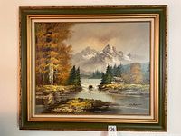 Largest oil painting depicting a mountainous landscape with pine trees and a river, framed in gold and green tones with artist signature H. Bruner visible