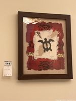 Framed original signed artwork with a turtle design and textured layered paper in a dark brown frame.