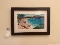 Framed original watercolour painting of a tropical beach scene with palm trees and ocean, showing the full piece including frame.