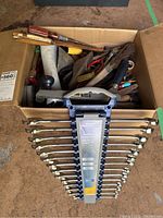 Mastercraft Maximum 14-piece combination wrench set displayed on a plastic rack showing both the wrenches and various hand tools in a cardboard box