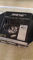 Box showing Bose branding and model QuietComfort 15 noise cancelling headphones, marked with lot information and condition notes.