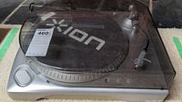 Front angled view of ION turntable with clear dust cover on.