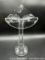 Front view of the clear glass vase showing its flared top shaped like a flower