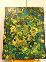 Front view of abstract acrylic painting with dominant green, blue, yellow, and black colors showing textured organic surface and finished sides.