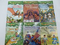 Photo showing all six Magic Tree House books laid out, titles and covers visible.