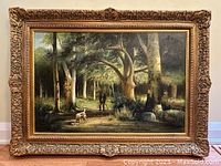 Full view of the framed oil painting showing hunter and dog in forest