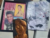 Lot showing framed Elvis Presley photos, tin art plaque, and packaged ELvis Presley Bradford Exchange T-shirt