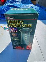 Box of Woods Holiday Power Stake showing product branding and model number 2428