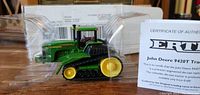 John Deere 9420T tracked tractor model in plastic case with certificate of authenticity visible.