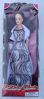 Front view of Holiday Jamie Barbie doll in original box showing doll and packaging condition.