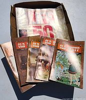 Box with a partially visible 'Life' magazine and four 'Old Stuff' magazines featuring illustrated rustic covers.