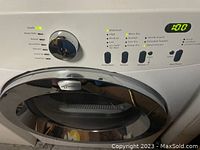 Close-up photo showing the digital control panel, chrome door, and drying options on the front of the Frigidaire Affinity dryer.