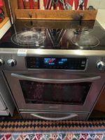Front view of KitchenAid convection oven showing Schott Ceran glass cooktop with three circular heating elements and digital control panel.