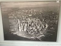 Full image showing aerial view of downtown Manhattan waterfront and cityscape with pier structures visible.