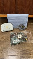 Photo showing the Michael Kors coin purse, blue jewelry portfolio, and packaged sleep set items.