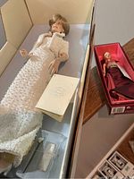 Diana Princess of Wales Barbie doll in original box with accessories visible.