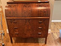 Full front view of the solid wood roll top desk showing the marbled wood pattern and multiple drawers.