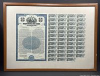 Full view of framed Republica de Cuba bond certificate with coupons attached, showing frame and mat.