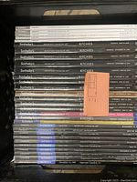 Stack of Sotheby's and Ritchies auction catalogs for important Canadian art, showing spines with dates and titles.