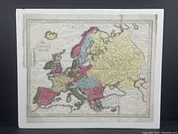 Full view of the antique hand-coloured map showing Europe with color-coded political regions and surrounding seas.