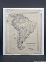 Front full view of the hand-coloured antique South America map mounted on foam-board in shrink-wrap showing entire continent with country borders and labels.