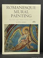 Front cover of Romanesque Mural Painting book showing title and colorful medieval mural painting image.