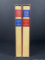 Two slipcased volumes showing spine labels and slight wear on slipcases.