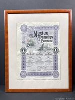 Full view of the framed Mexico Tramways Company share certificate, showing the entire document and wood frame.