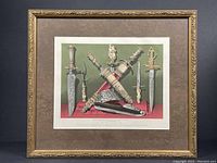 Full view of the chromolithograph print in antique gilt frame showing multiple swords and knives.