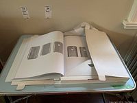 Book open on table showing interior product pages