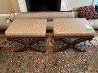 Two matching benches side by side in front of fireplace, showing overall appearance