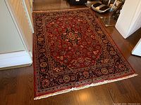 Full top-down view of rug on hardwood floor
