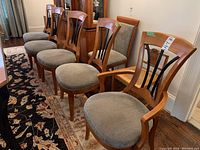 Five chairs arranged in a row showing overall lot