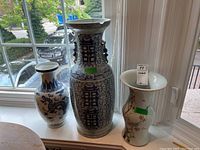 All three vases displayed on windowsill