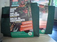 Front view of two dark green grow bags with packaging showing brand name Schmidt and description in English, French, and Spanish.