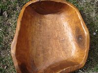 Top view showing the interior of the large hand carved wooden bowl with natural wood grain and smooth finish.