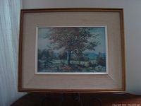 Framed Autumn Maple print showing autumn maple tree by fence with scenic background