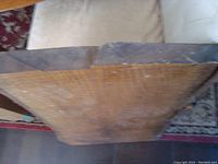 Top view showing thickness and natural wood grain from above, rough unfinished edges visible.