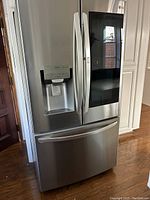 Front view of stainless steel French door refrigerator with bottom freezer