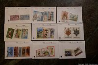 Nine stock cards, each filled with various used Bermuda stamps showing a wide range of designs and colors.