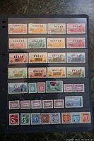 Black album page with five horizontal rows of Chinese stamps.