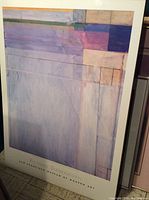 Full view of the large mounted poster showing Richard Diebenkorn abstract artwork with varying shades of purple, pink, blue, and white.