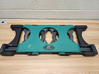 Top view of closed green and black plastic case with horseshoes inside showing brand logo 'Eastpoint'.