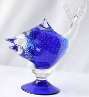 Side angle view of the Lavorazione Arte Murano glass fish sculpture with detailing of bubbles and blue and clear glass sections