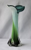 Side view of the Murano glass vase showing color gradient and flower-shaped top.