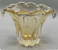 Side view of honey gold tinted Murano glass vase with scalloped rim and pulled glass design.
