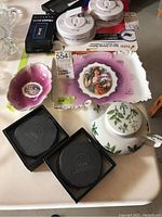 Photo showing Royal Bavaria small dish, rectangular tray, Sadek tea-for-one teapot, and two sets of black slate coasters on a beige surface.