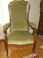 Front view of chair showing overall design, upholstery and frame.